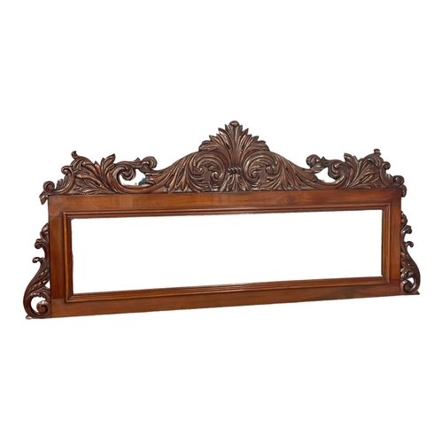 1075 - A large Victorian carved mahogany mirror. 168x76.5cm