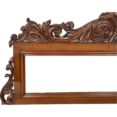 1075 - A large Victorian carved mahogany mirror. 168x76.5cm