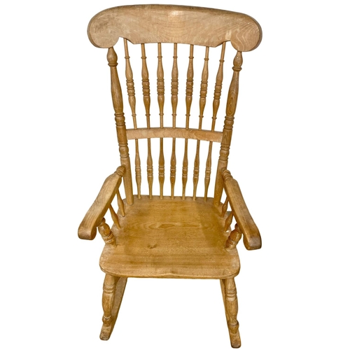 1076 - An early 20th century Elm and Beech rocking chair.