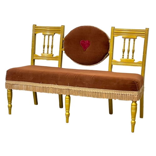 1084 - An Edwardian painted love seat. 144cm