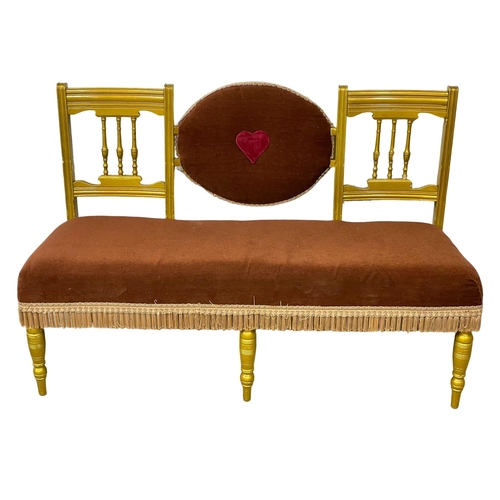 1084 - An Edwardian painted love seat. 144cm