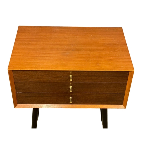 1089 - A Mid Century teak cutlery chest. 59x38x77cm