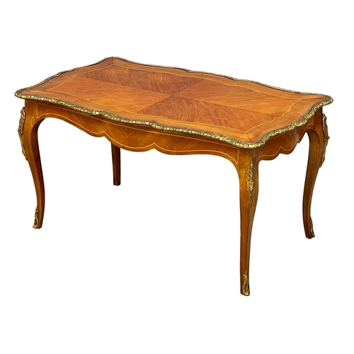 1091 - A good quality French inlaid coffee table with ornate brass Ormolu mounts. 96x58.5x50.5cm