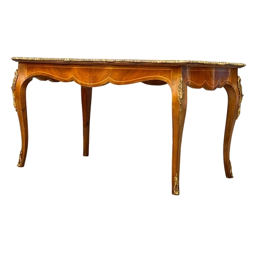 1091 - A good quality French inlaid coffee table with ornate brass Ormolu mounts. 96x58.5x50.5cm