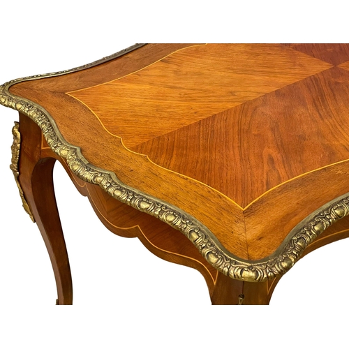 1091 - A good quality French inlaid coffee table with ornate brass Ormolu mounts. 96x58.5x50.5cm