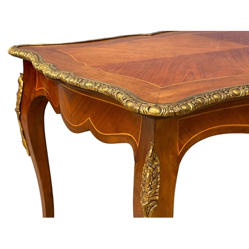 1091 - A good quality French inlaid coffee table with ornate brass Ormolu mounts. 96x58.5x50.5cm