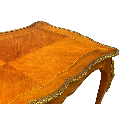 1091 - A good quality French inlaid coffee table with ornate brass Ormolu mounts. 96x58.5x50.5cm