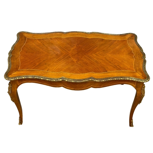 1091 - A good quality French inlaid coffee table with ornate brass Ormolu mounts. 96x58.5x50.5cm