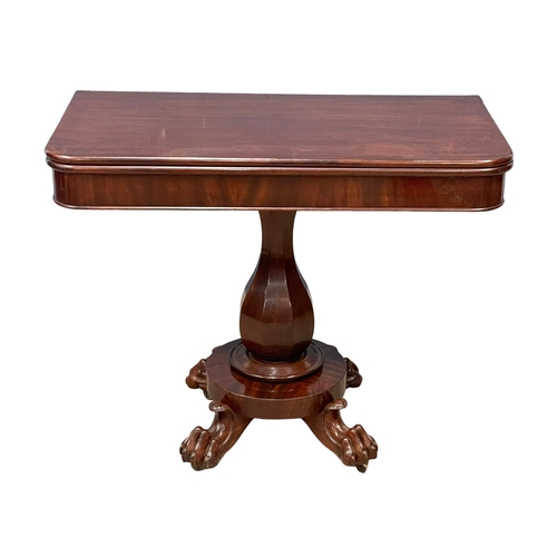 1094 - A William IV mahogany turnover tea table on paw feet. Circa 1830. 91x45.5x74cm