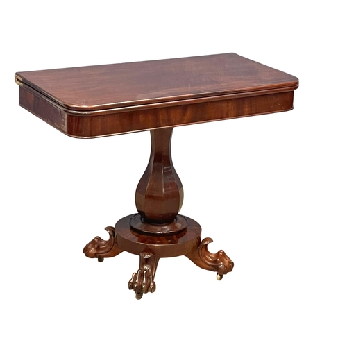 1094 - A William IV mahogany turnover tea table on paw feet. Circa 1830. 91x45.5x74cm