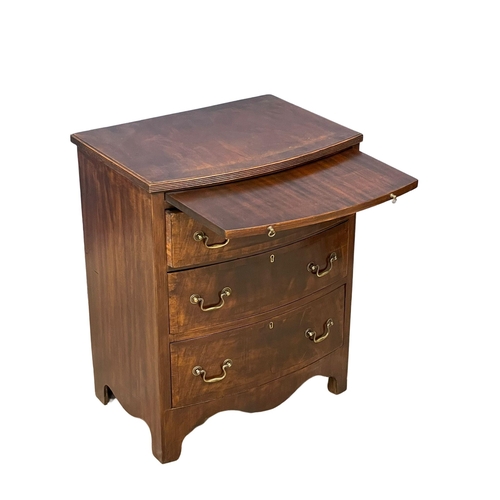 1095 - A vintage Georgian style mahogany bow front chest of drawers, with brushing slide and brass drop han... 