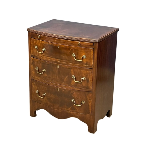 1095 - A vintage Georgian style mahogany bow front chest of drawers, with brushing slide and brass drop han... 