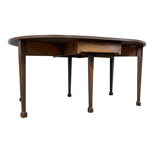 1097 - A large late George III mahogany drop leaf dining table, with 6 legs. Circa 1800-1820. Open 159x127x... 