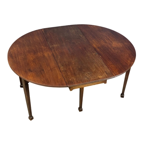 1097 - A large late George III mahogany drop leaf dining table, with 6 legs. Circa 1800-1820. Open 159x127x... 