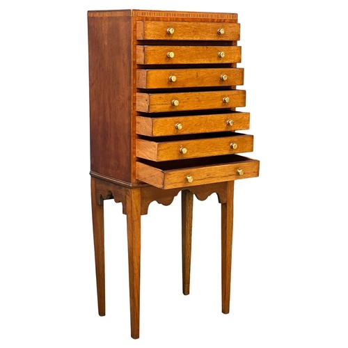 1098 - An Edwardian inlaid mahogany multi drawer chest. 40x25x98.5cm