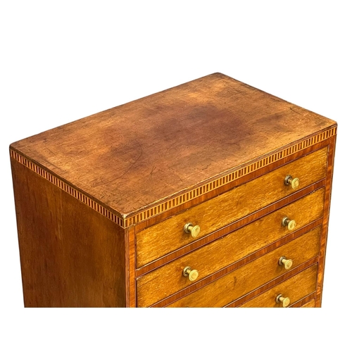 1098 - An Edwardian inlaid mahogany multi drawer chest. 40x25x98.5cm