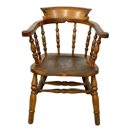 1106 - A Victorian Elm and Beech armchair.