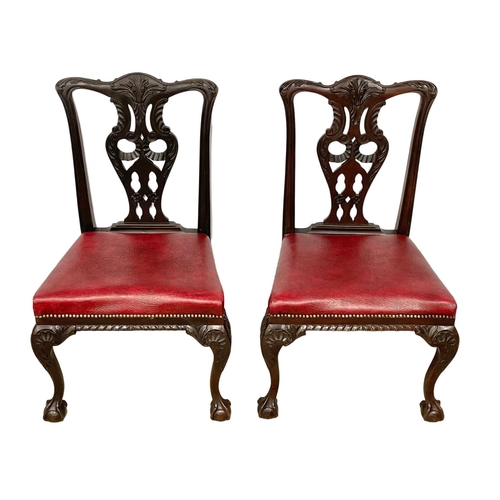 1109 - A pair of good quality early 20th century Irish Chippendale Revival mahogany chairs, with leather se... 