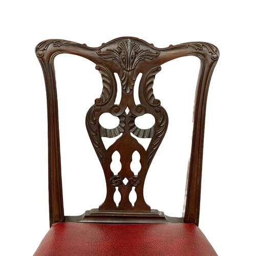 1109 - A pair of good quality early 20th century Irish Chippendale Revival mahogany chairs, with leather se... 