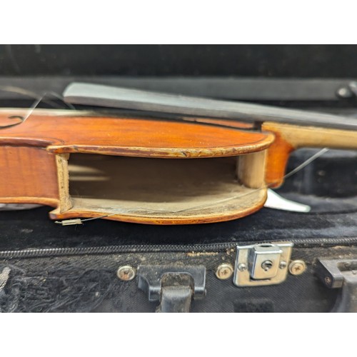 195J - An early 20th century violin with Antonius Stradivarius label, including violin chords, etc.