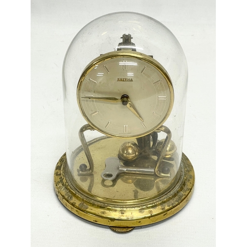 85 - 2 vintage brass 400 Day Anniversary clock with glass domes. Largest 33cm