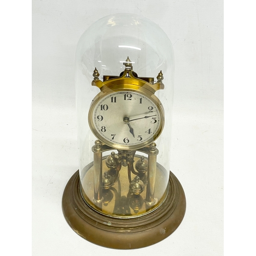 85 - 2 vintage brass 400 Day Anniversary clock with glass domes. Largest 33cm