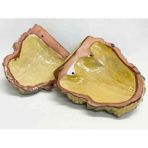 604 - A pair of large Majolica style terracotta wall planters. 33x38cm