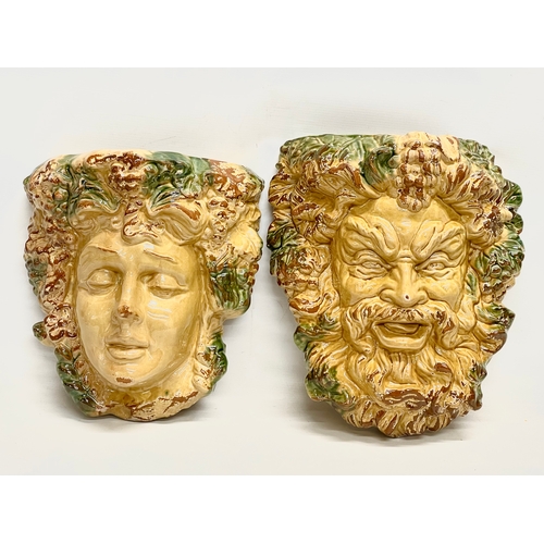 604 - A pair of large Majolica style terracotta wall planters. 33x38cm