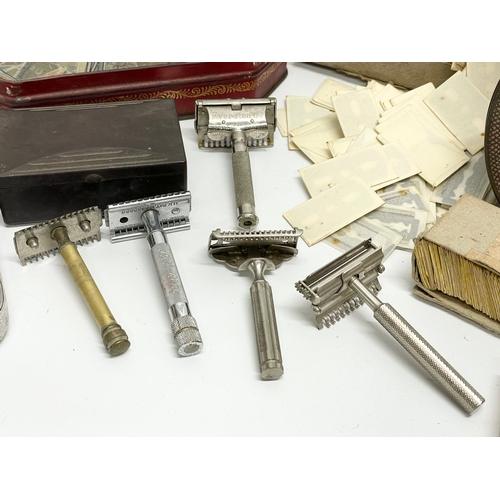 89 - A collection of vintage razors and blades etc.