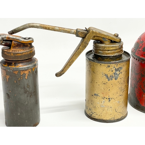 92 - 3 vintage oil cans. Largest 32x25cm