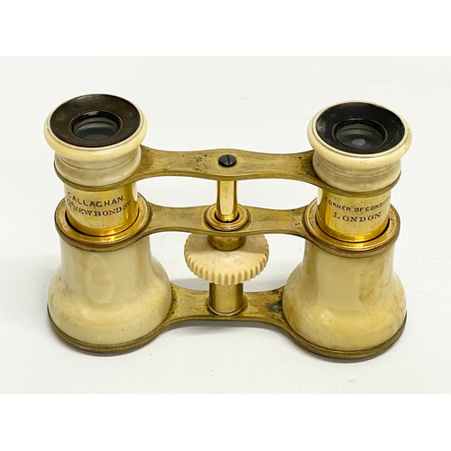 93 - A set of early 20th century bone and brass opera glasses in case by Callaghan of London.