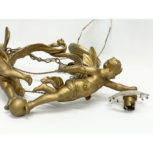 7 - A 3 piece early 20th century cherub spelter light fitting. Circa 1900-1910. Largest piece 50x41cm