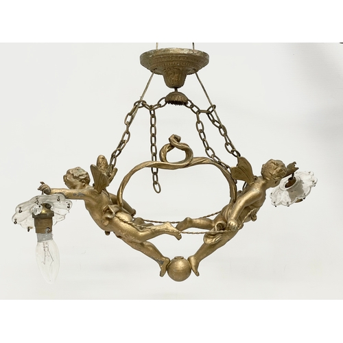 7 - A 3 piece early 20th century cherub spelter light fitting. Circa 1900-1910. Largest piece 50x41cm