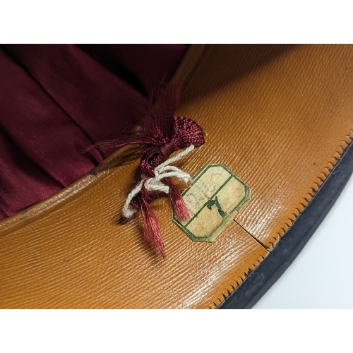 129 - A vintage satin lined bowler hat, London Style. Feather weight.