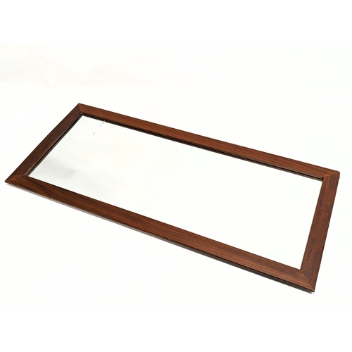 127 - A Mid Century teak framed mirror. 74.5x32.5cm