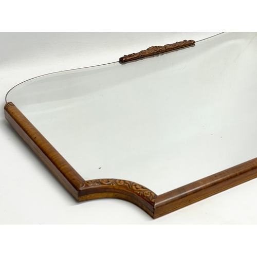 46 - An early 20th century Walnut framed bevelled mirror. 76.5x47.5cm