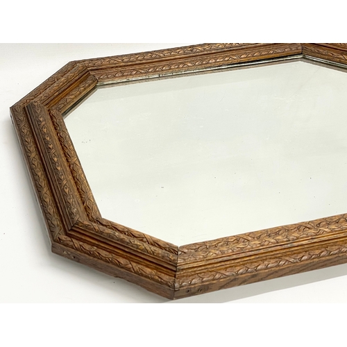 220 - An early 20th century ornate oak framed mirror. Circa 1900-1920. 64x54cm