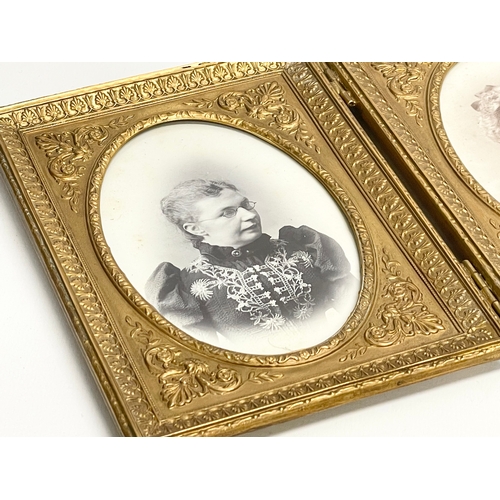 11 - A Victorian ornate brass double photo frame. 25.5x16.5cm