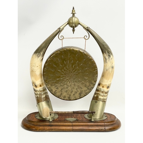 12 - A large Victorian dinner gong made from horn, silver plate and oak. 44x52cm