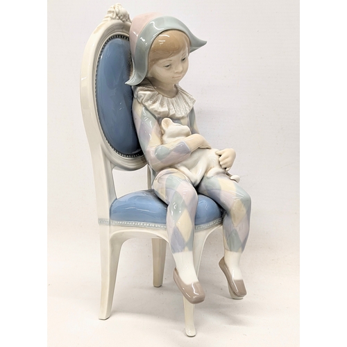 653 - A Lladro pottery figure, 