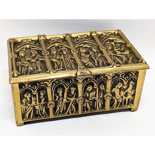 13 - A late 19th century ornate brass trinket box depicting medieval gothic figures. 15x9.5x7cm