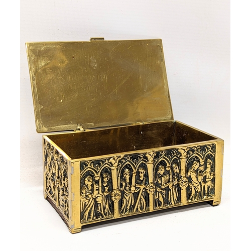 13 - A late 19th century ornate brass trinket box depicting medieval gothic figures. 15x9.5x7cm