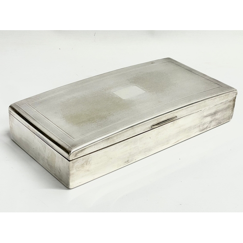 655 - A large vintage silver plated tabletop cigarette box. 25.5x13x5cm