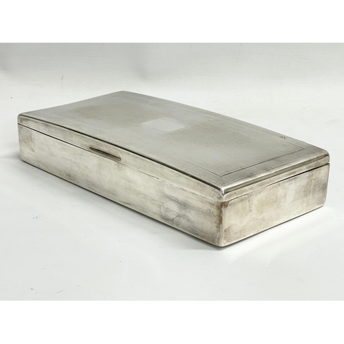 655 - A large vintage silver plated tabletop cigarette box. 25.5x13x5cm