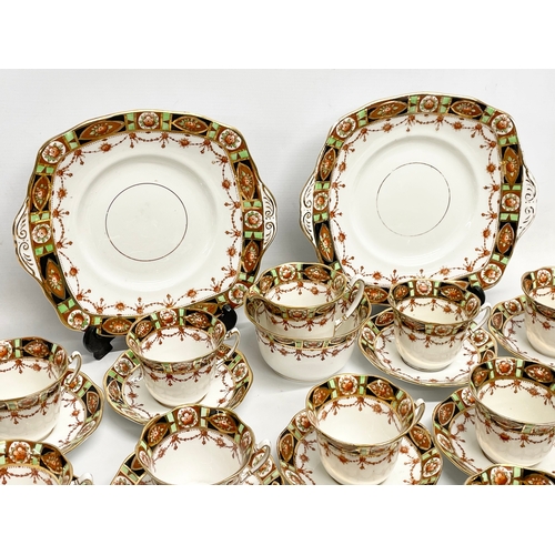 656 - A 28 piece early to mid 20th century Roslyn China tea set.