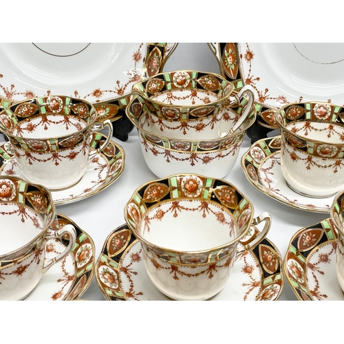 656 - A 28 piece early to mid 20th century Roslyn China tea set.