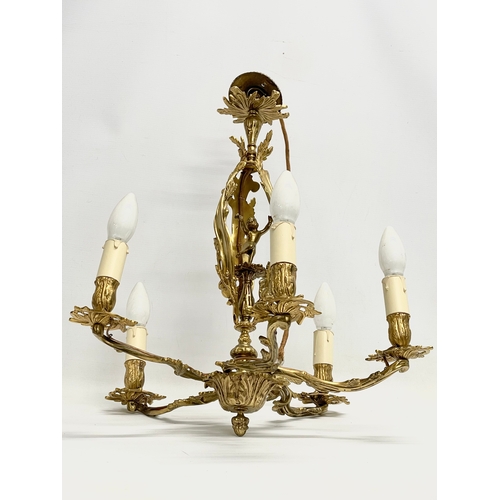 42 - A good quality vintage Rococo style brass chandelier. 46x51cm