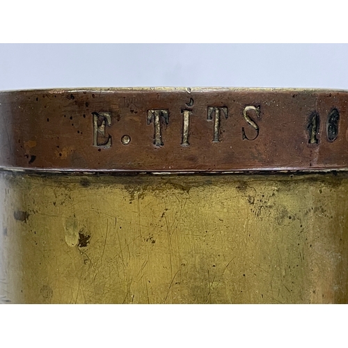 638 - A large 19th century brass jug. Stamped E. Tits and T. Vaks. 26x41cm