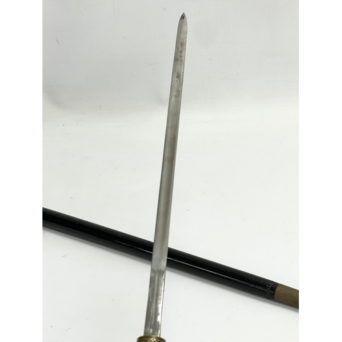 23 - An early 20th century Indian bone and wooden sword stick. 59cm