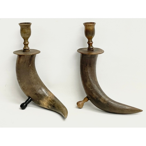 642 - A pair of late 19th century tusk candlesticks with horn tops.